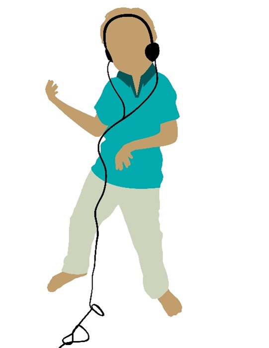 Boy wearing headphones playing an air guitar