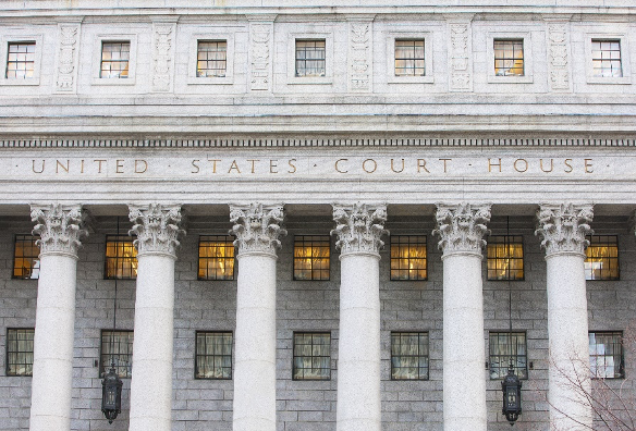 Front of the U.S. Supreme Court Building with six columns below engraved UNITED STATES COURT HOUSE