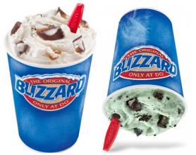 Two cups with BLIZZARD labels containing frozen semi-soft ice cream