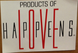 Sign stating PRODUCTS OF LOVE (with LOVE in larger red letters) superimposed over HAPPENS.