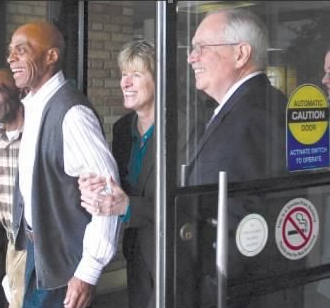 Photo of Edward Elmore, Diana Holt and Chris Jensen walking out of the Greenwood County Courthouse Photo of Edward Elmore, Diana Holt and Chris Jensen walking out of the Greenwood County Courthouse