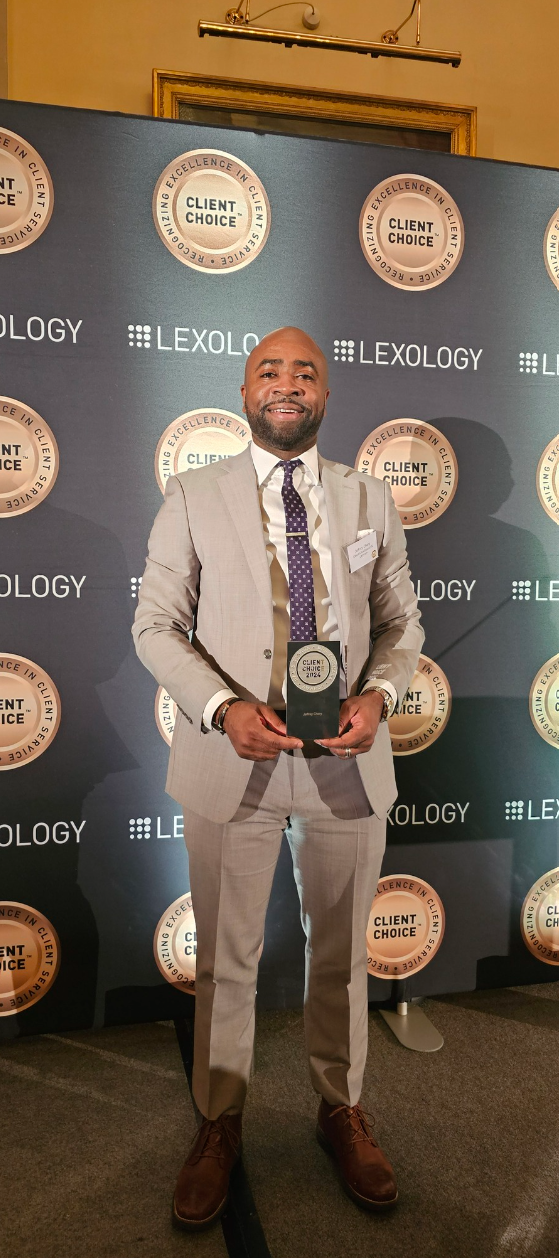 Photo of Jeffery Chery and his award.