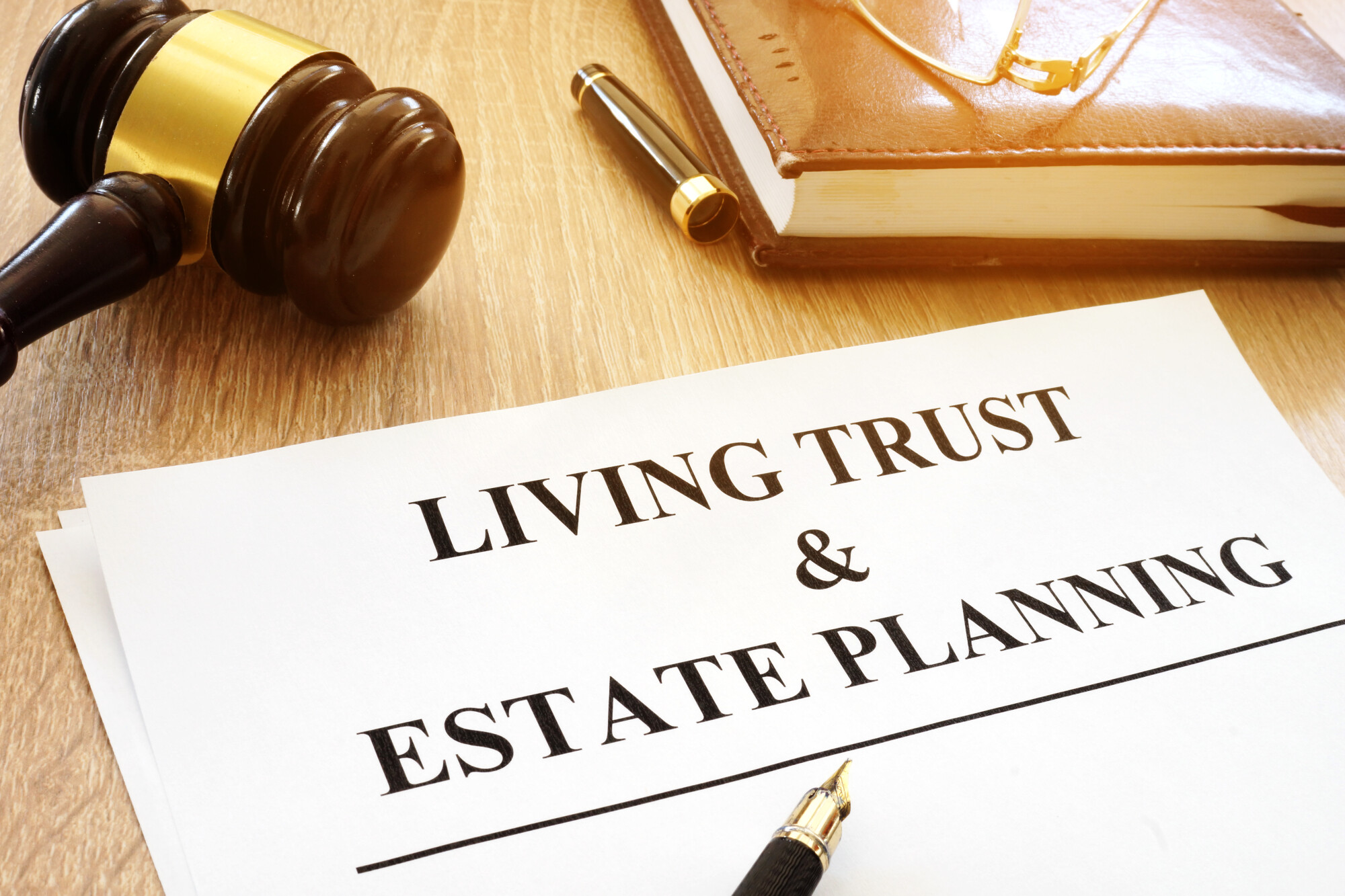 Living Trust & Estate Planning” form on a desk.