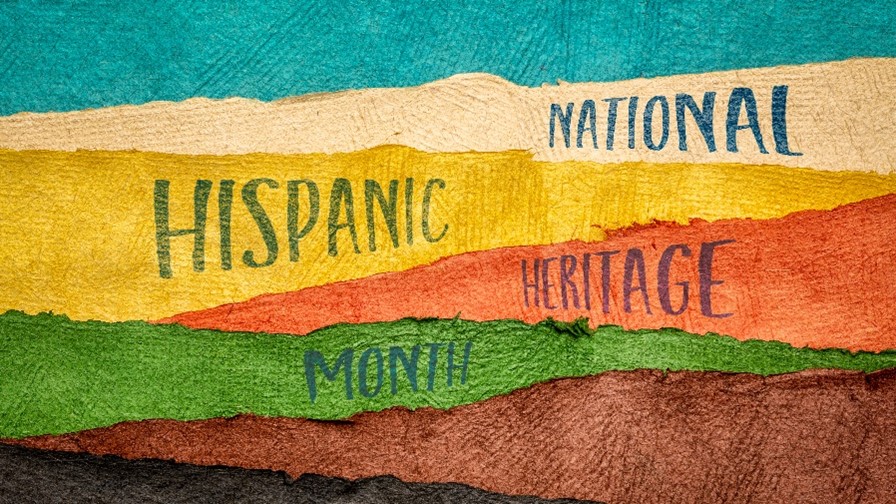 “NATIONAL HISPANIC HERITAGE MONTH” superimposed on a background of uneven bands each of a different color.