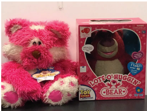 Plaintiff’s stuffed pink teddy bear with a tag displaying LOTS OF HUGS on the left; Disney’s stuffed pink teddy bear in a box displaying LOTS-O’-HUGGIN’ on the right.