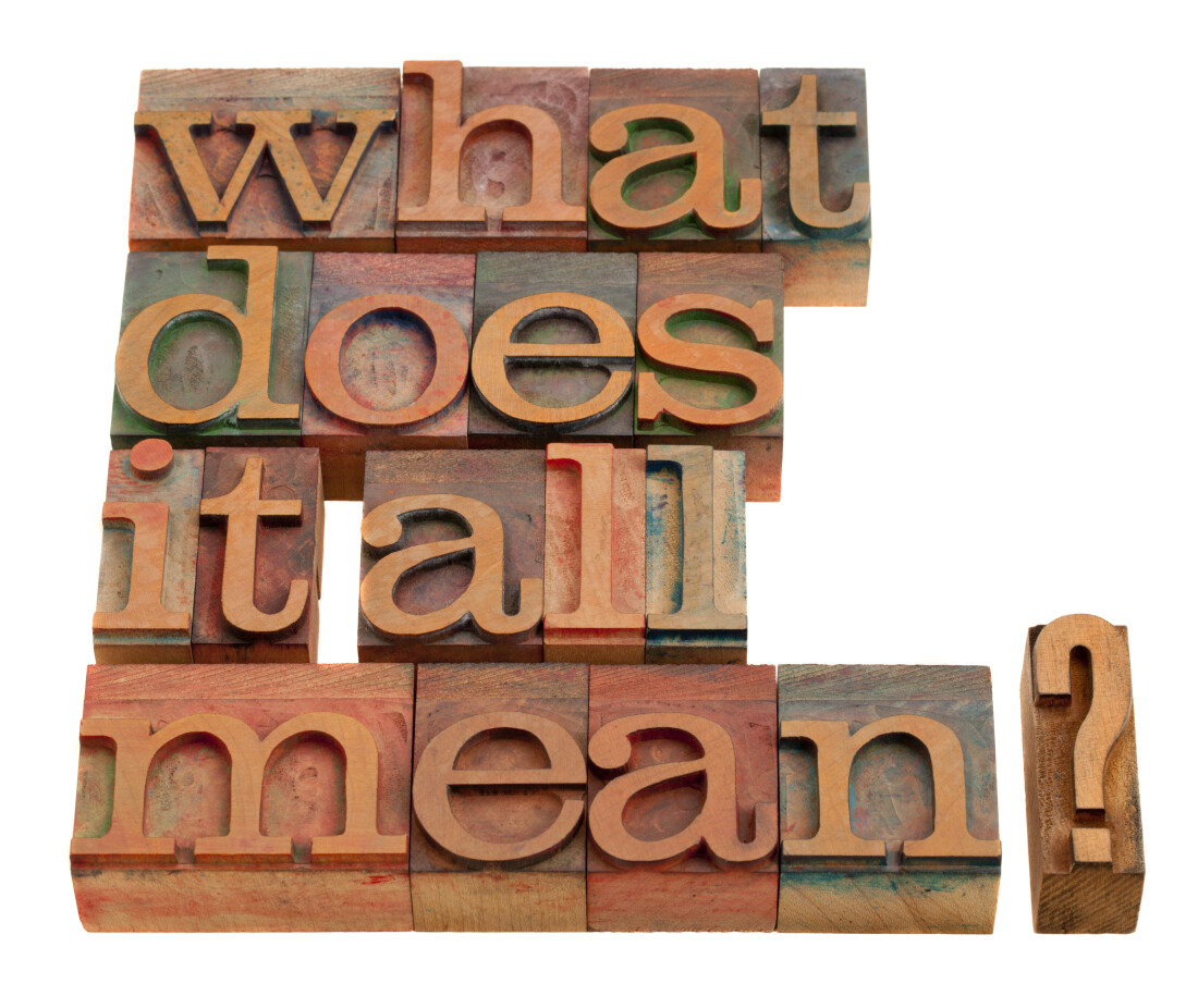 Printing blocks spelling “what does it all mean?”