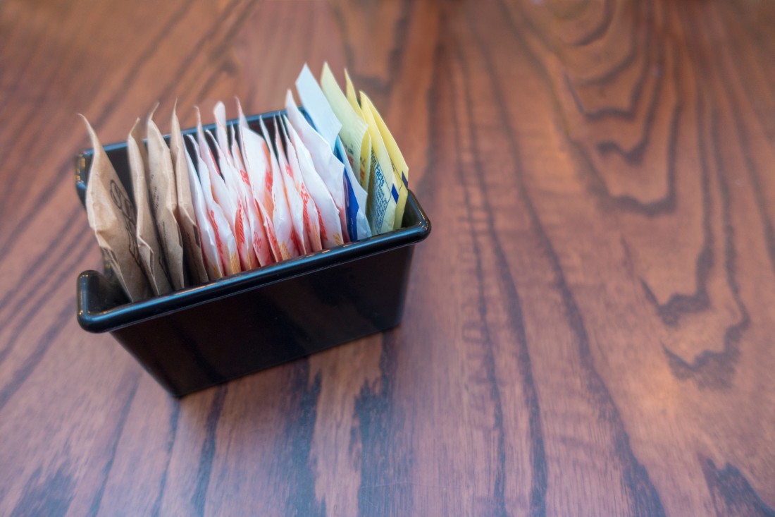 Picture of restaurant container for various colored sweetener packets