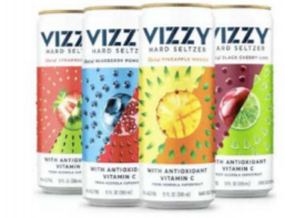 On the left, BRIZZY cans tapered on top and bottom, with solid color backgrounds behind digital dots forming different shaped glasses, and with “Seltzer Cocktail” in small text.  On the right, VIZZY cylindrical cans with white backgrounds and pictures of fruit in two-color panels, and with “Hard Seltzer” in small text and “With Antioxidant Vitamin C” in bold letters