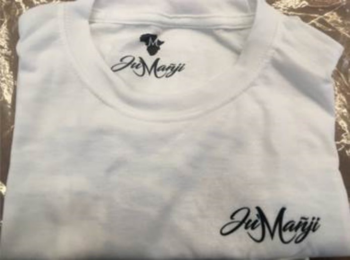 Right:  Applicant’s T-shirt displaying the word JU’MAÑJI inside the back of the neck and on the left side of the front.